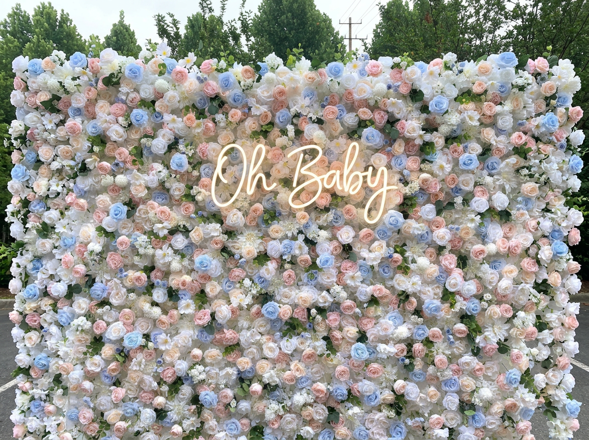 Oh Baby neon sign on blush flower wall